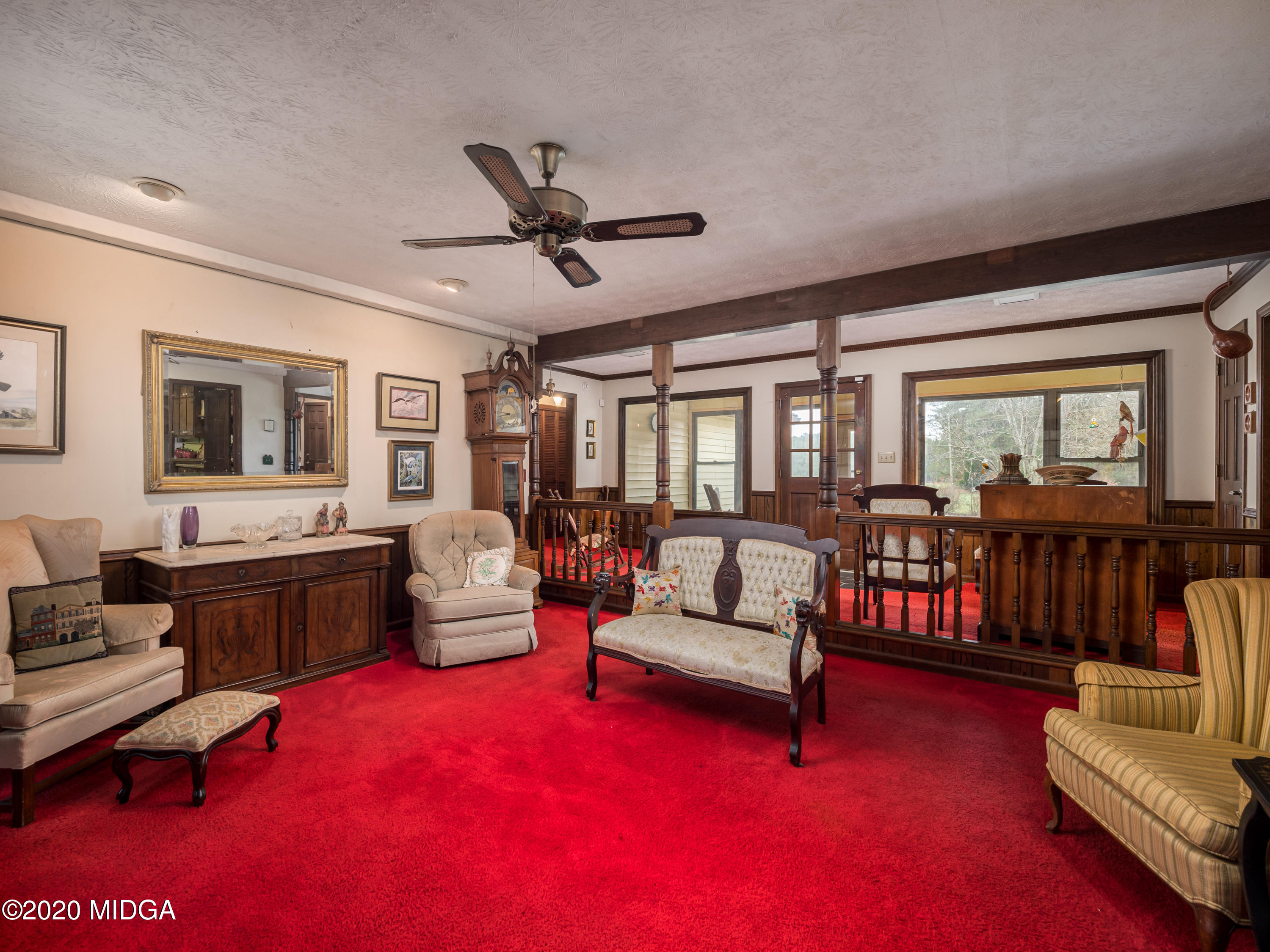 115 Hasty Road Jackson, GA 30233 - Photo 10 of 36 a living room with furniture and a large window