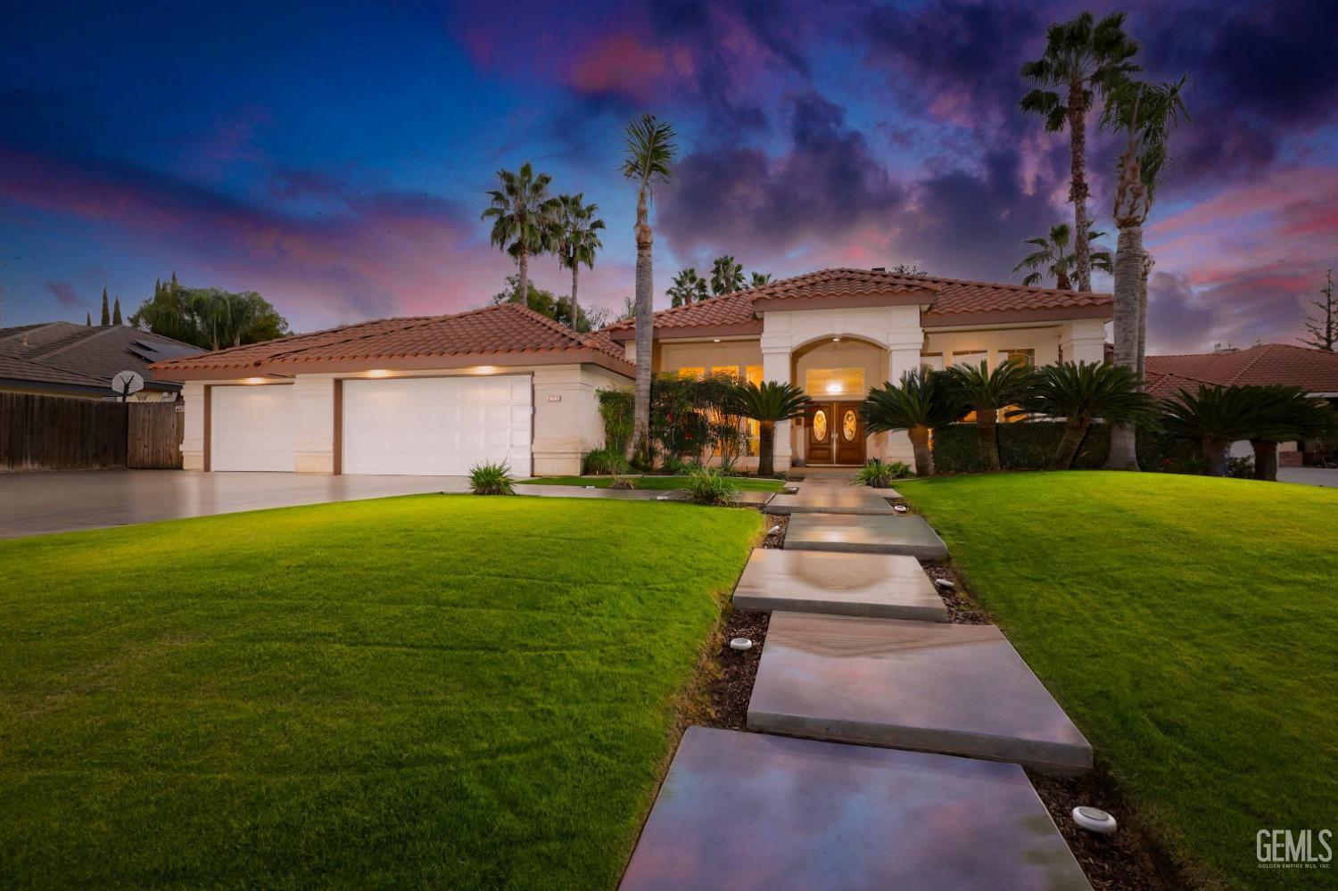 Undisclosed Address Bakersfield, CA 93312 - Photo 1 of 39 a front view of a house with garden
