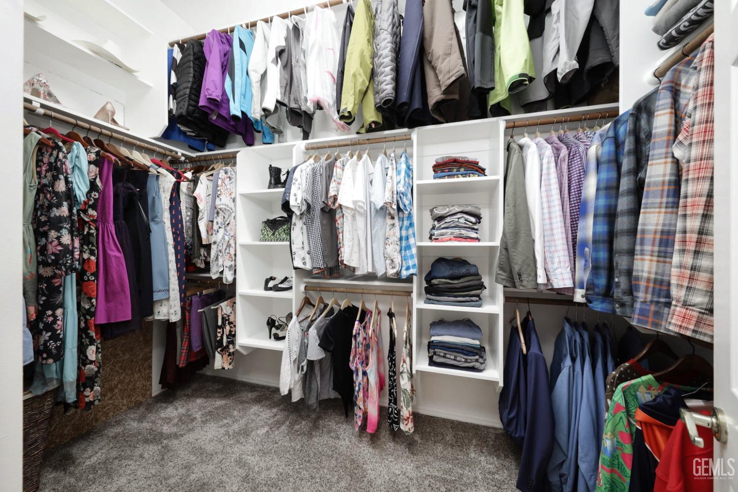 Undisclosed Address Bakersfield, CA 93312 - Photo 15 of 39 a view of walk in closet with clothes