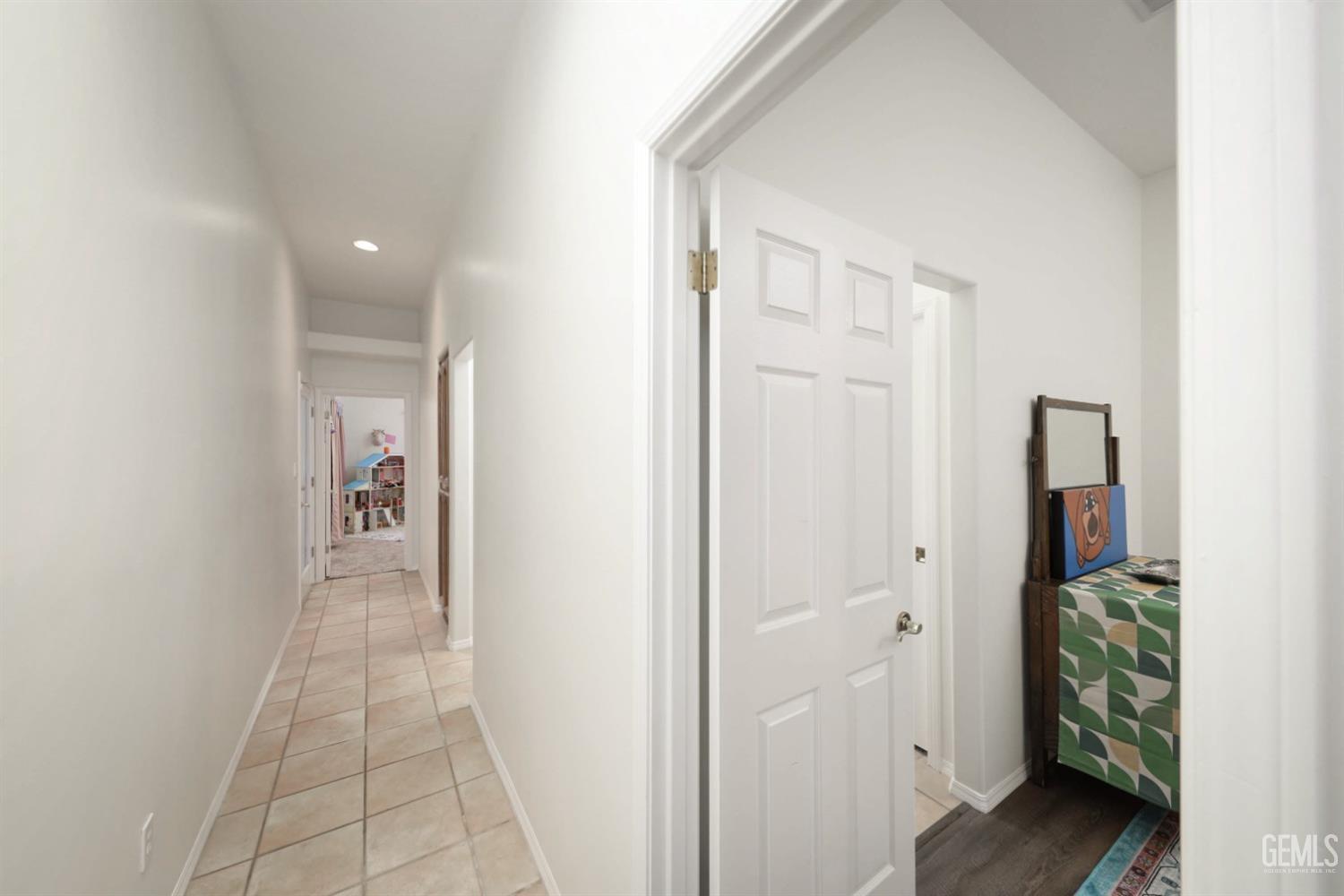 Undisclosed Address Bakersfield, CA 93312 - Photo 16 of 39 a view of a hallway with some storage area