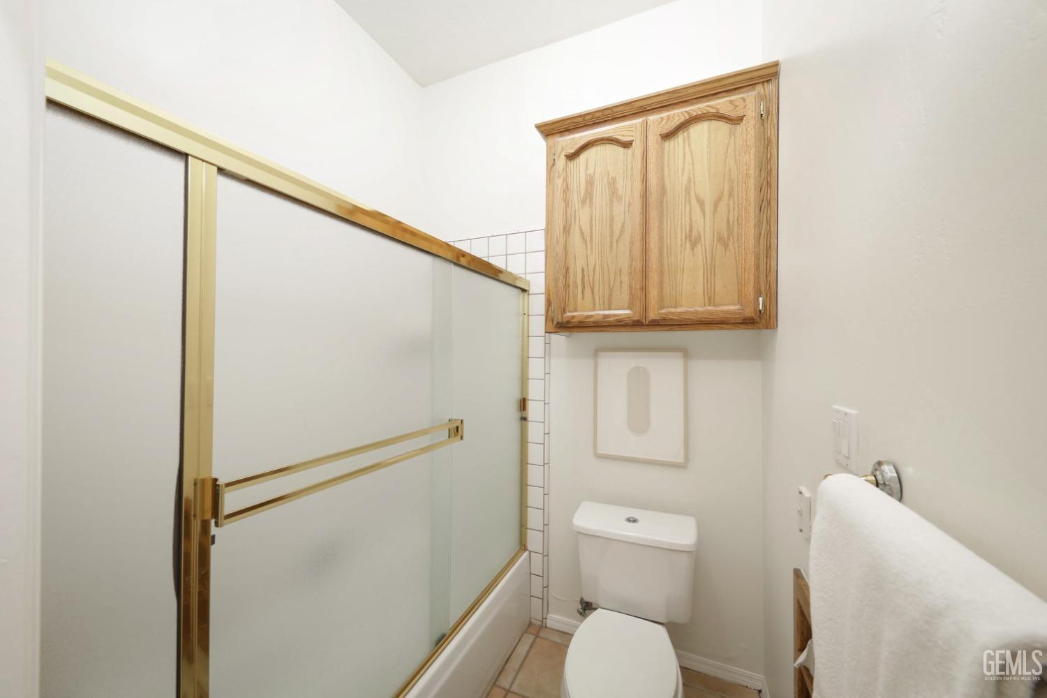 Undisclosed Address Bakersfield, CA 93312 - Photo 19 of 39 a bathroom with a toilet and a shower