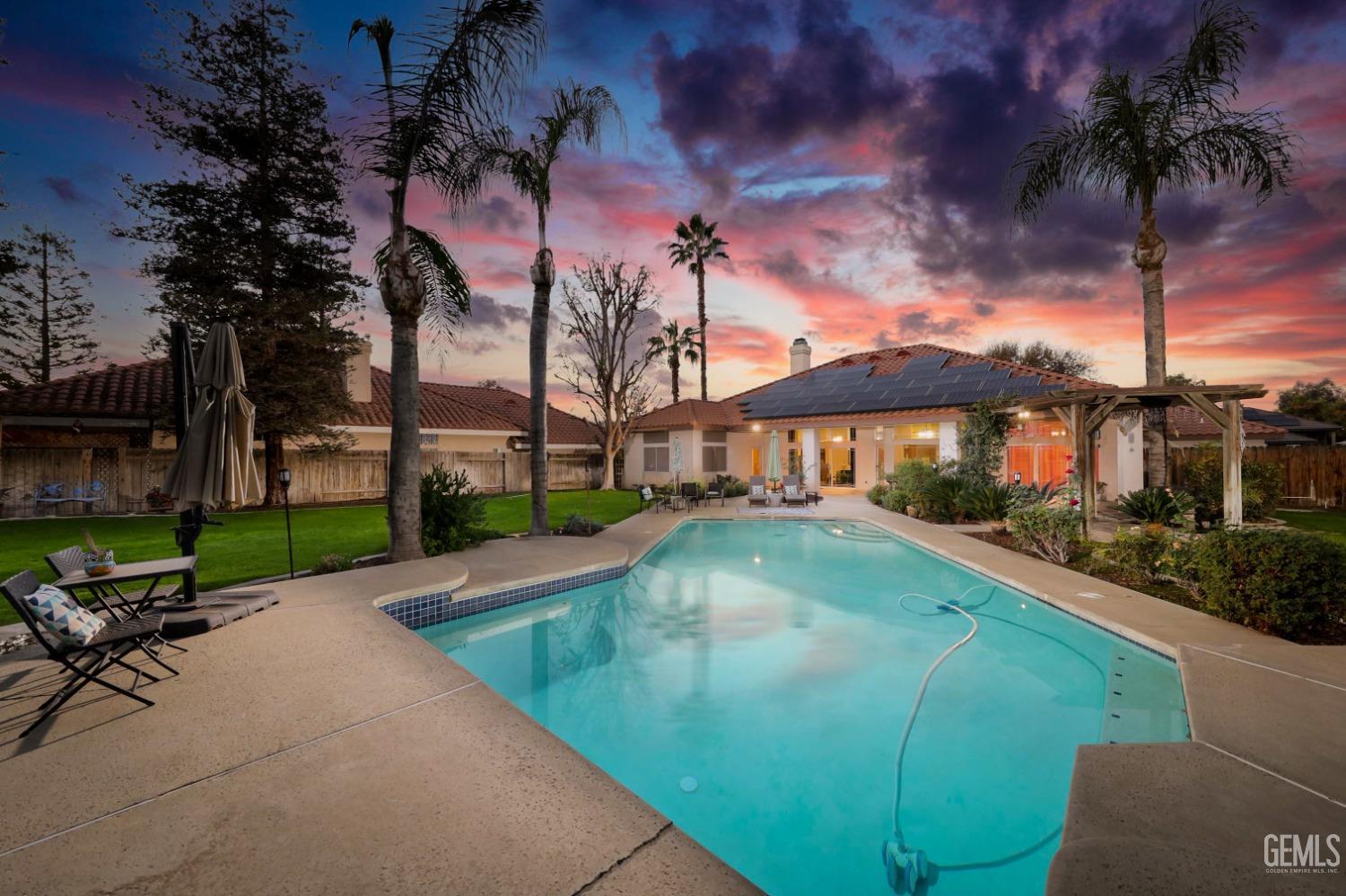 Undisclosed Address Bakersfield, CA 93312 - Photo 2 of 39 a view of a swimming pool with a patio