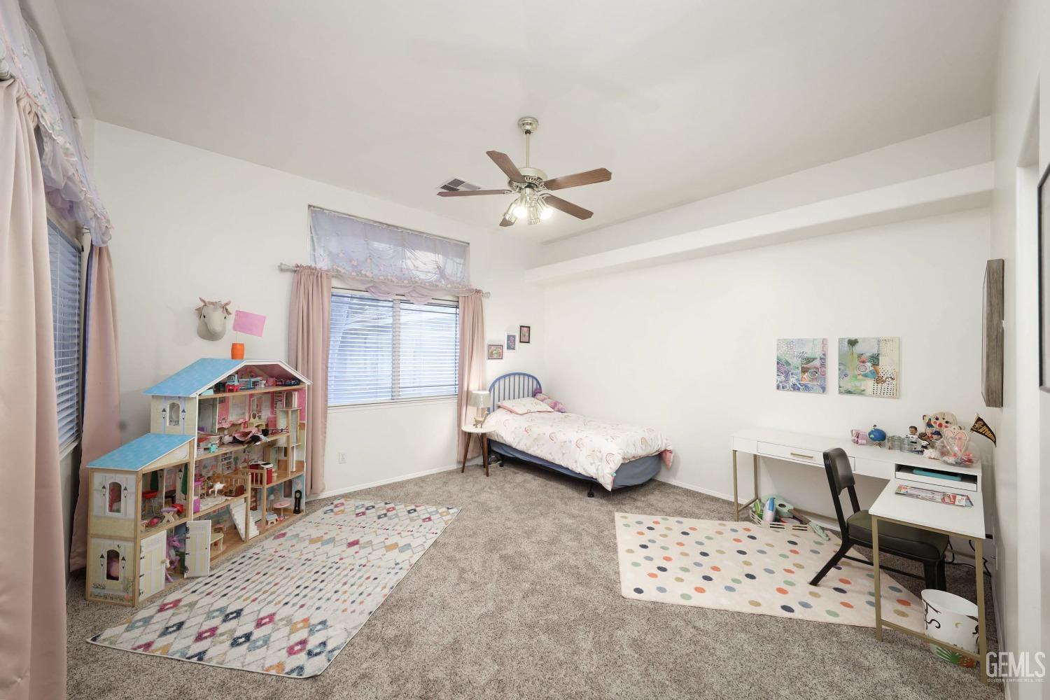 Undisclosed Address Bakersfield, CA 93312 - Photo 21 of 39 a bedroom with furniture and a window