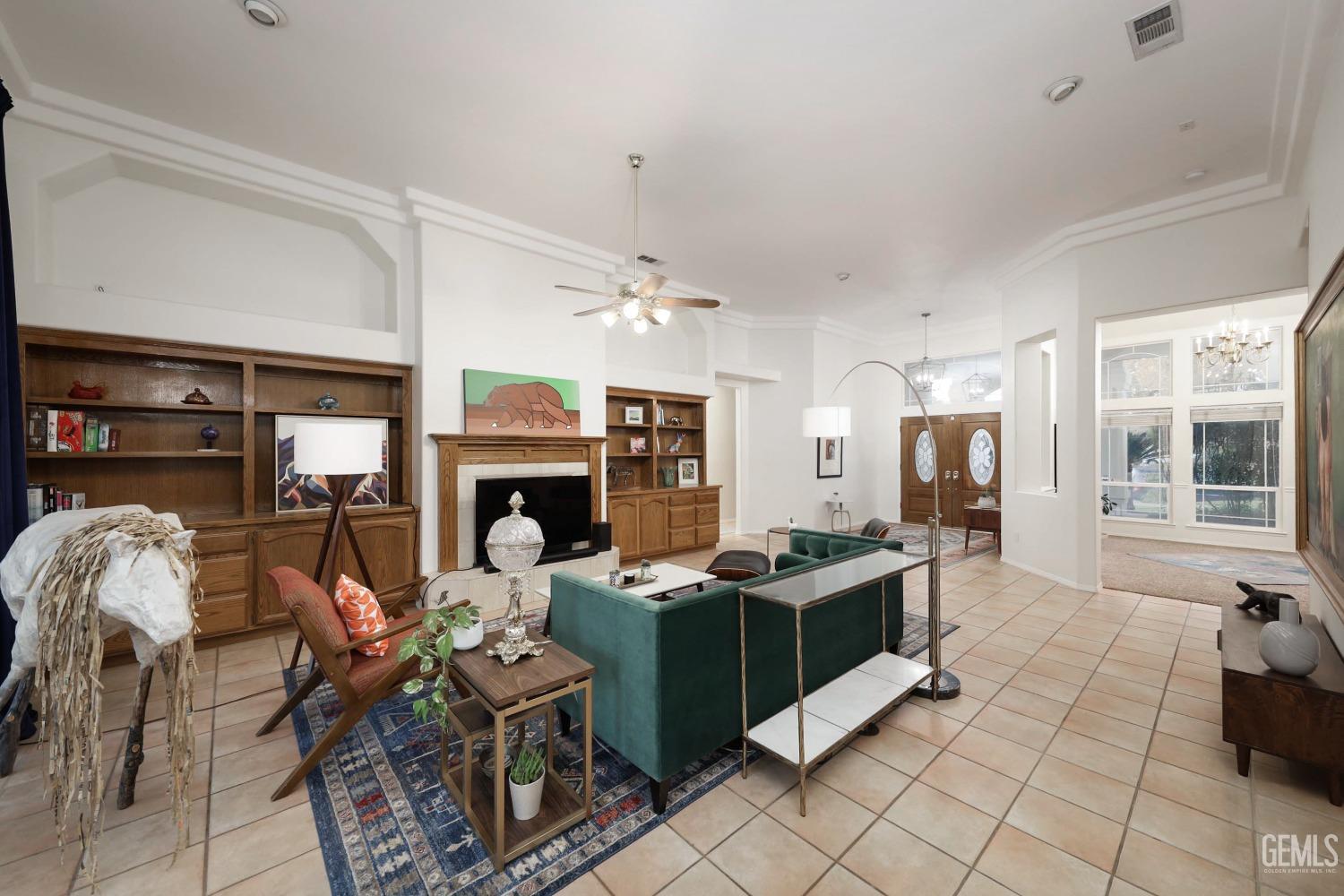 Undisclosed Address Bakersfield, CA 93312 - Photo 25 of 39 a living room with furniture a fireplace and a large window