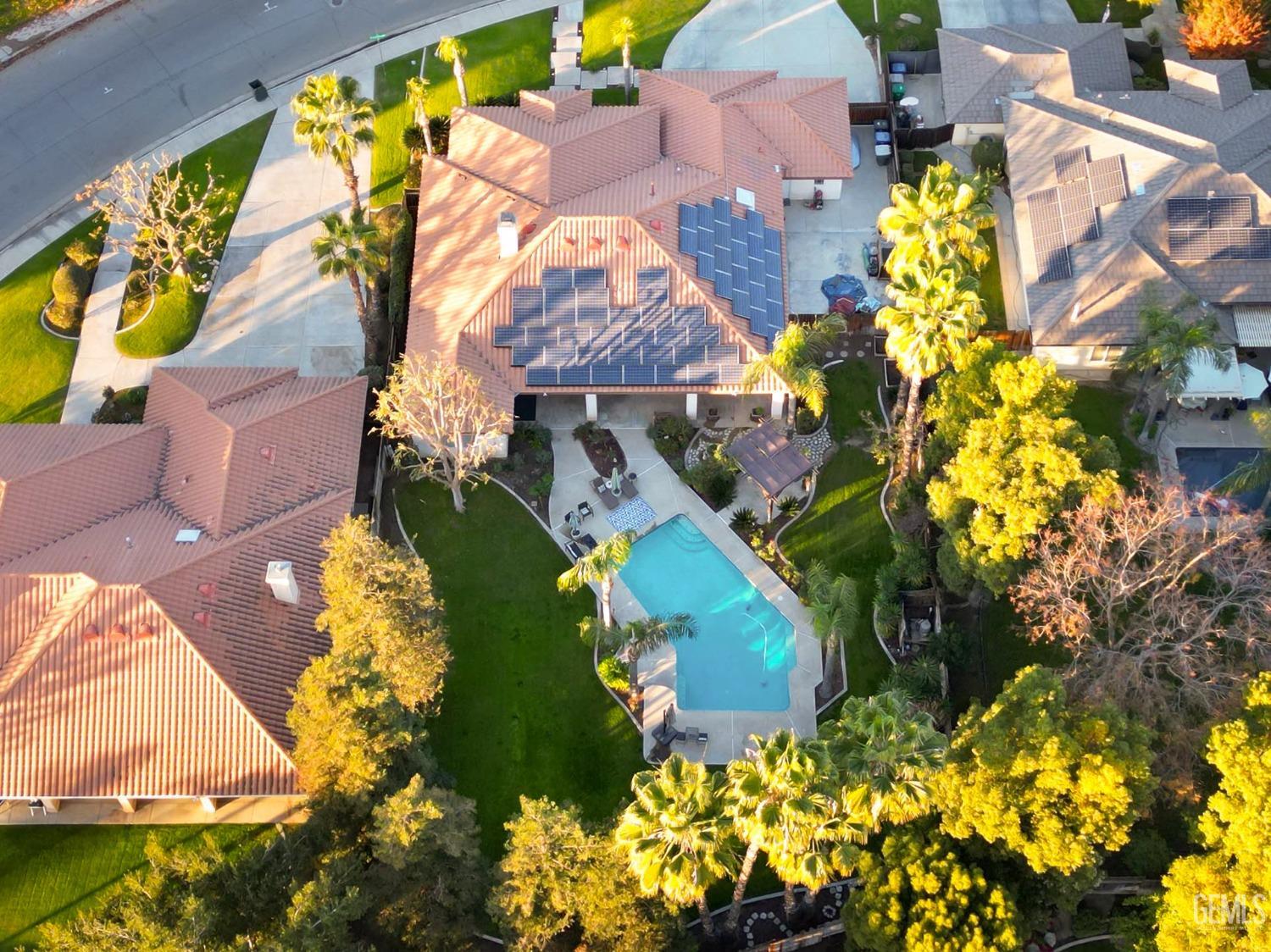 Undisclosed Address Bakersfield, CA 93312 - Photo 31 of 39 an aerial view of residential house with yard and swimming pool