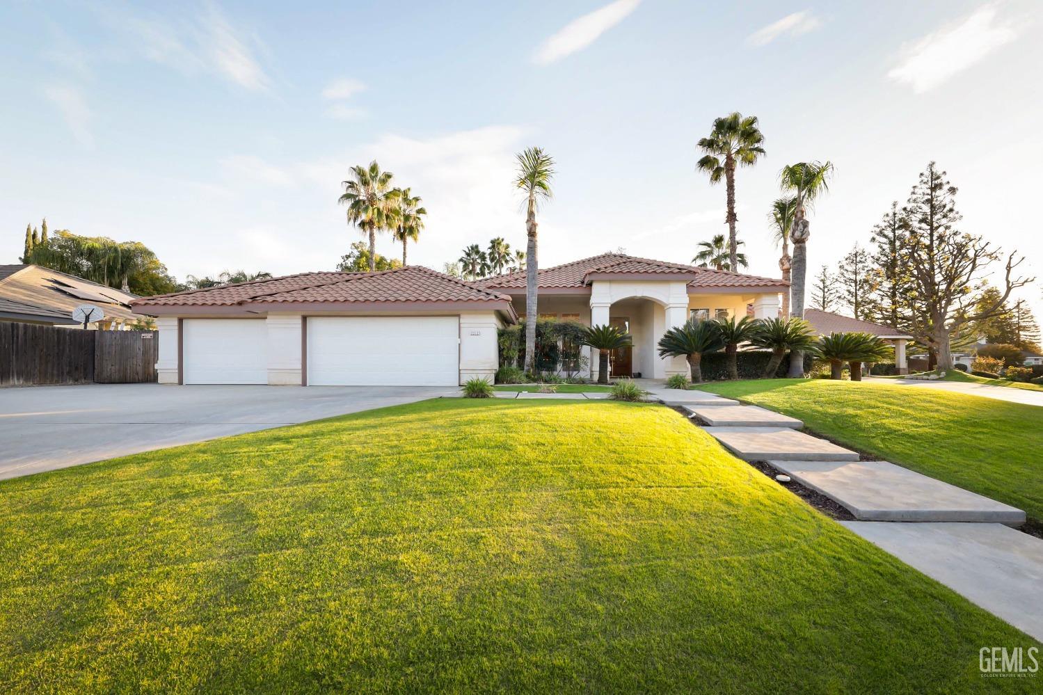 Undisclosed Address Bakersfield, CA 93312 - Photo 37 of 39 a front view of a house with a yard