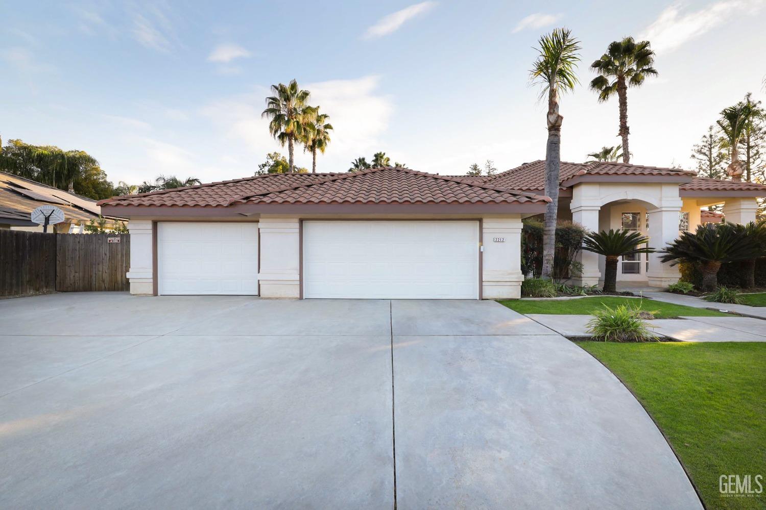 Undisclosed Address Bakersfield, CA 93312 - Photo 38 of 39 a view of a house with a yard and garage