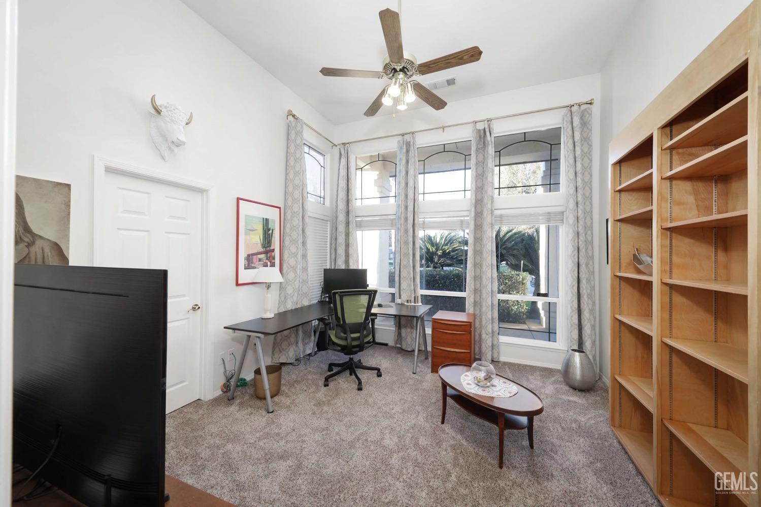 Undisclosed Address Bakersfield, CA 93312 - Photo 10 of 39 a living room with furniture and a window