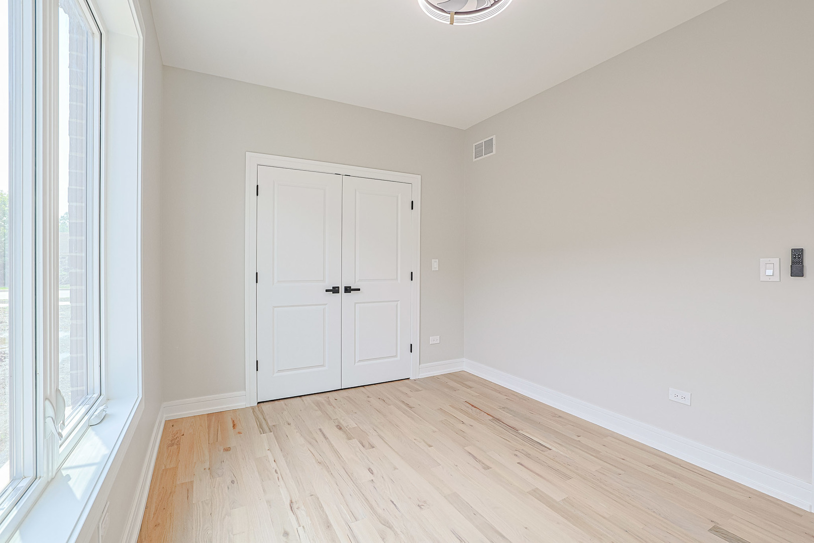 7948 West 74th Avenue Bridgeview, IL 60455 - Photo 11 of 39 an empty room with wooden floor