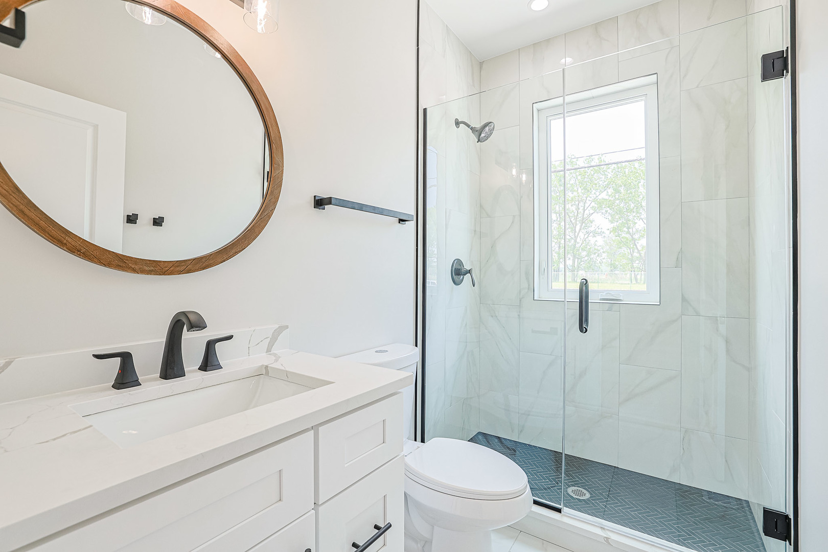 7948 West 74th Avenue Bridgeview, IL 60455 - Photo 12 of 39 a bathroom with a sink a toilet and shower