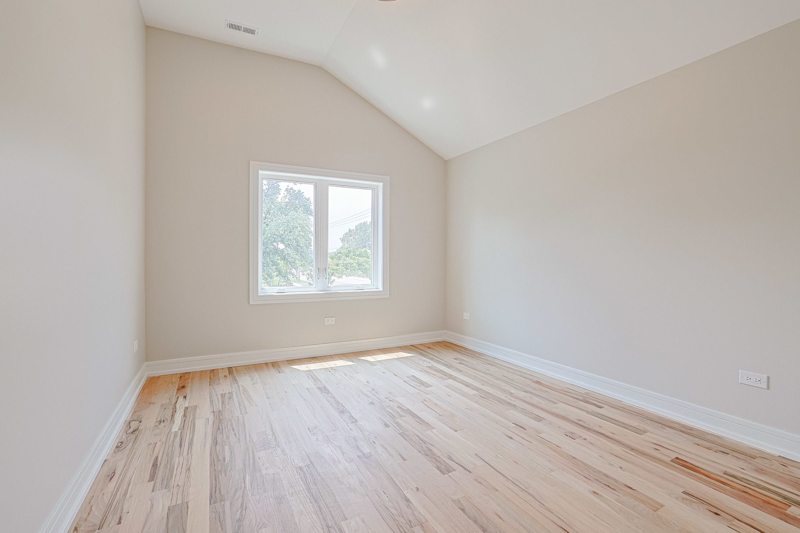 7948 West 74th Avenue Bridgeview, IL 60455 - Photo 23 of 39 an empty room with wooden floor and windows