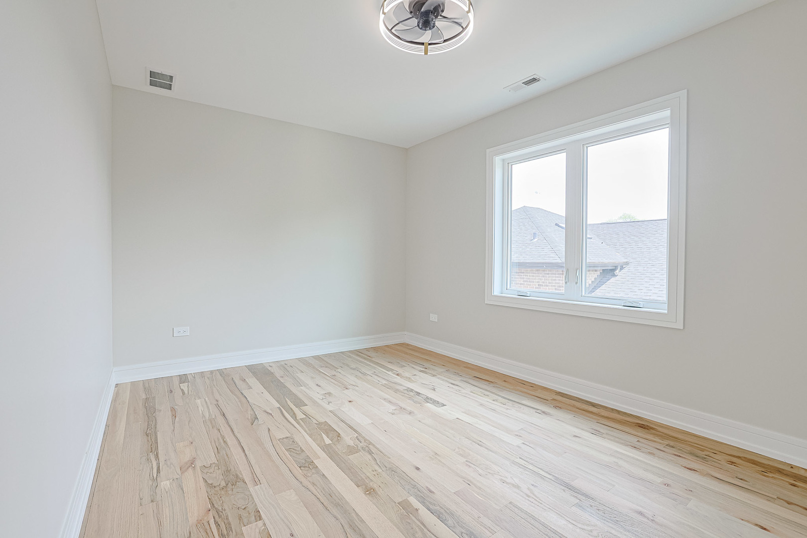 7948 West 74th Avenue Bridgeview, IL 60455 - Photo 26 of 39 a view of room with window and hardwood floor