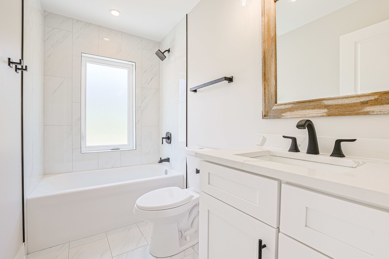 7948 West 74th Avenue Bridgeview, IL 60455 - Photo 28 of 39 a bathroom with a sink a toilet and shower