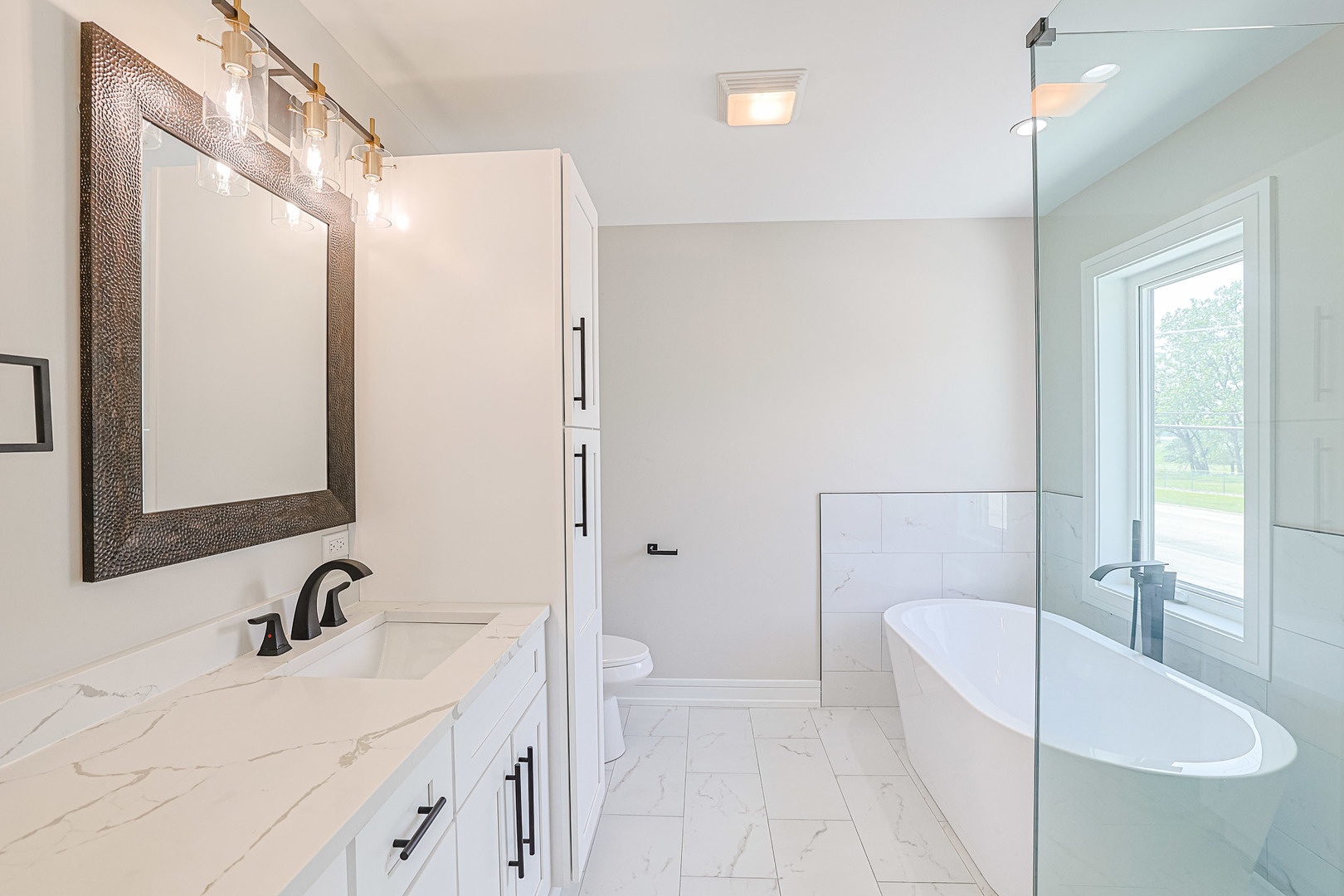 7948 West 74th Avenue Bridgeview, IL 60455 - Photo 31 of 39 a bathroom with a sink a toilet and shower