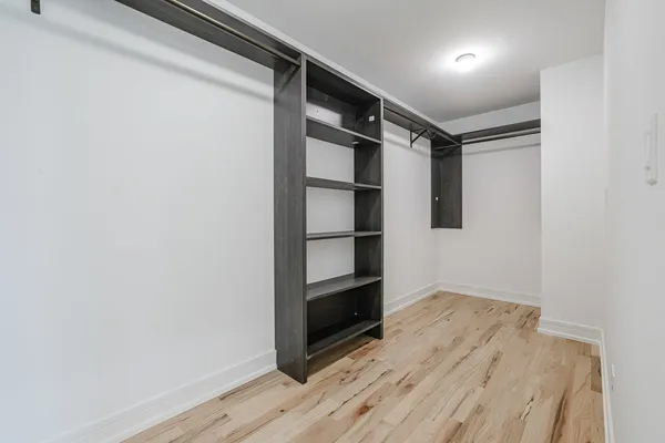 a view of an empty walk in closet