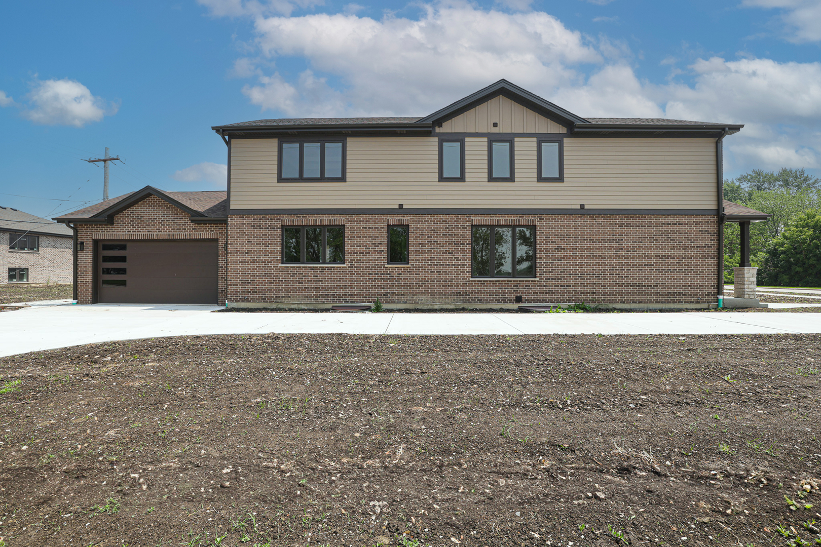 7948 West 74th Avenue Bridgeview, IL 60455 - Photo 4 of 39 a front view of a house with a yard