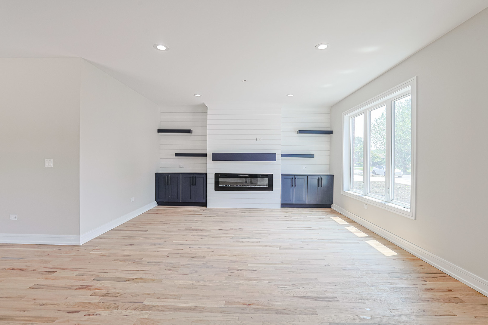 7948 West 74th Avenue Bridgeview, IL 60455 - Photo 7 of 39 a view of a room with an empty space and a window