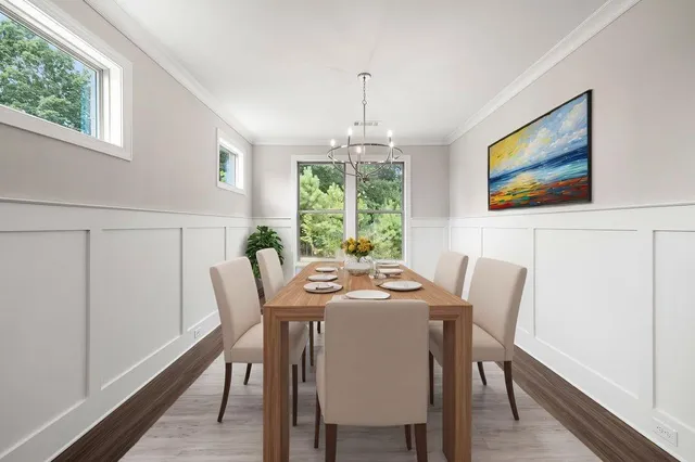 a view of a dining room with furniture window and outside view