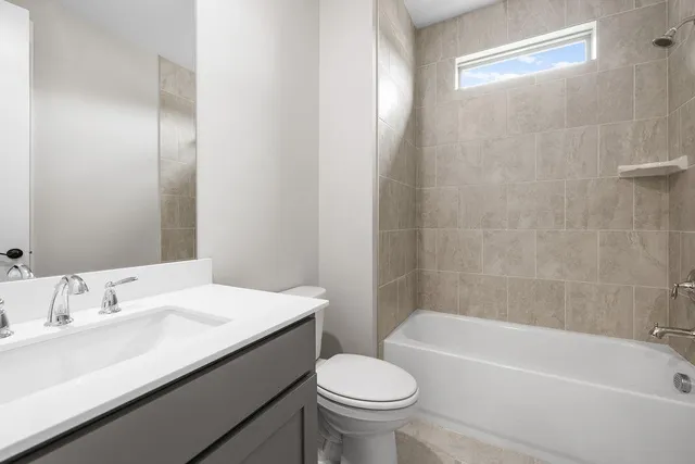 a bathroom with a sink a toilet and a bathtub