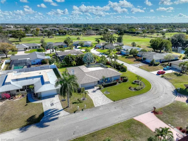 an aerial view of a house with a swimming pool