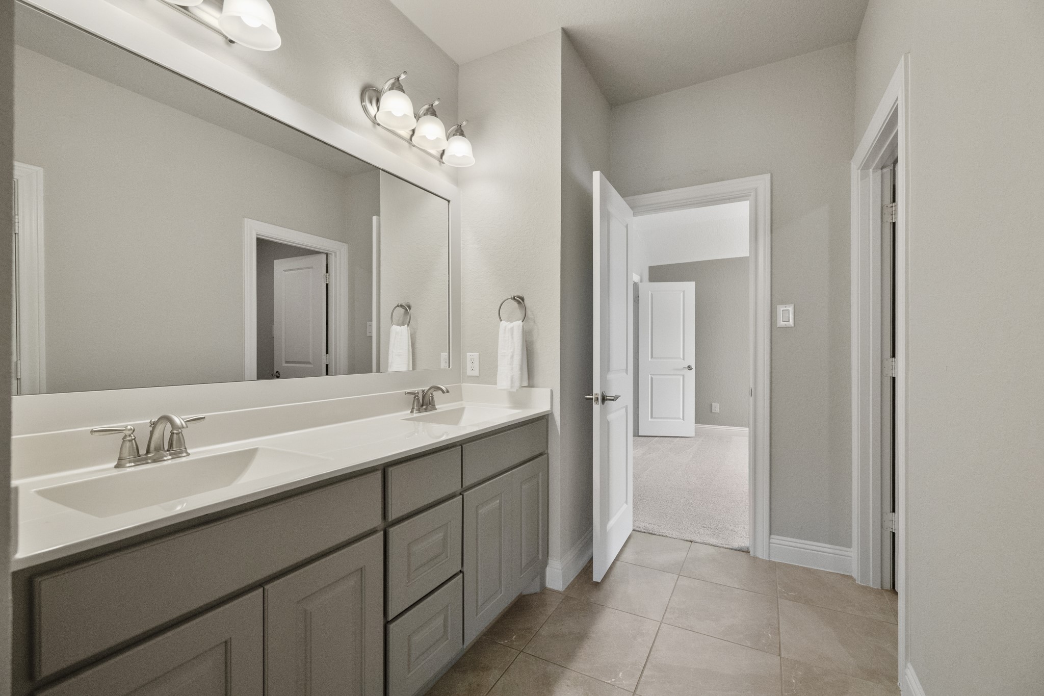 7502 Windsor Park Court Spring, TX 77379 - Photo 29 of 50 a spacious bathroom with a double vanity sink shower and a mirror