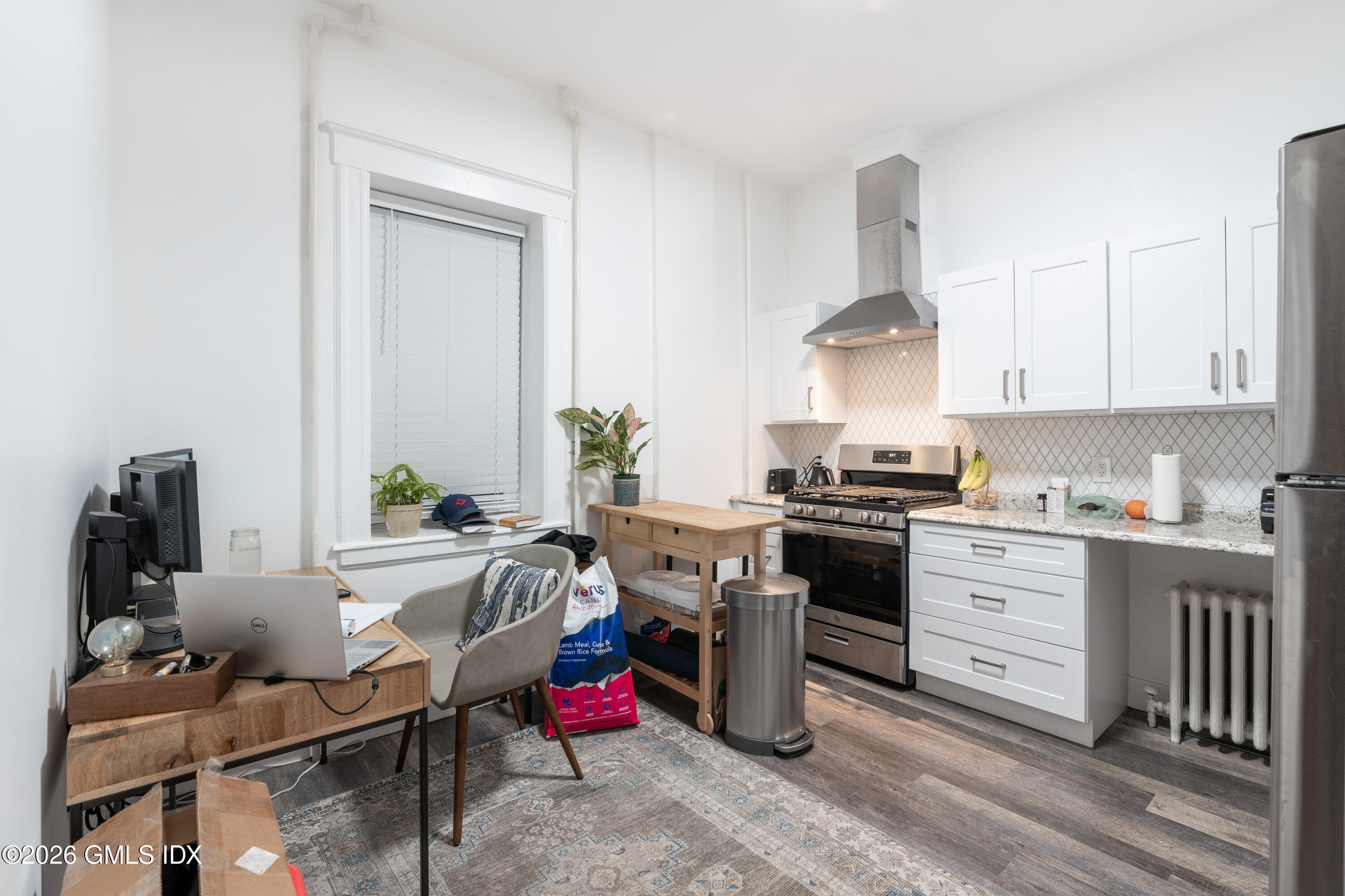 140 Hamilton Avenue, Unit 1 Greenwich, CT 06830 - Photo 2 of 7 a kitchen with a sink stove and cabinets