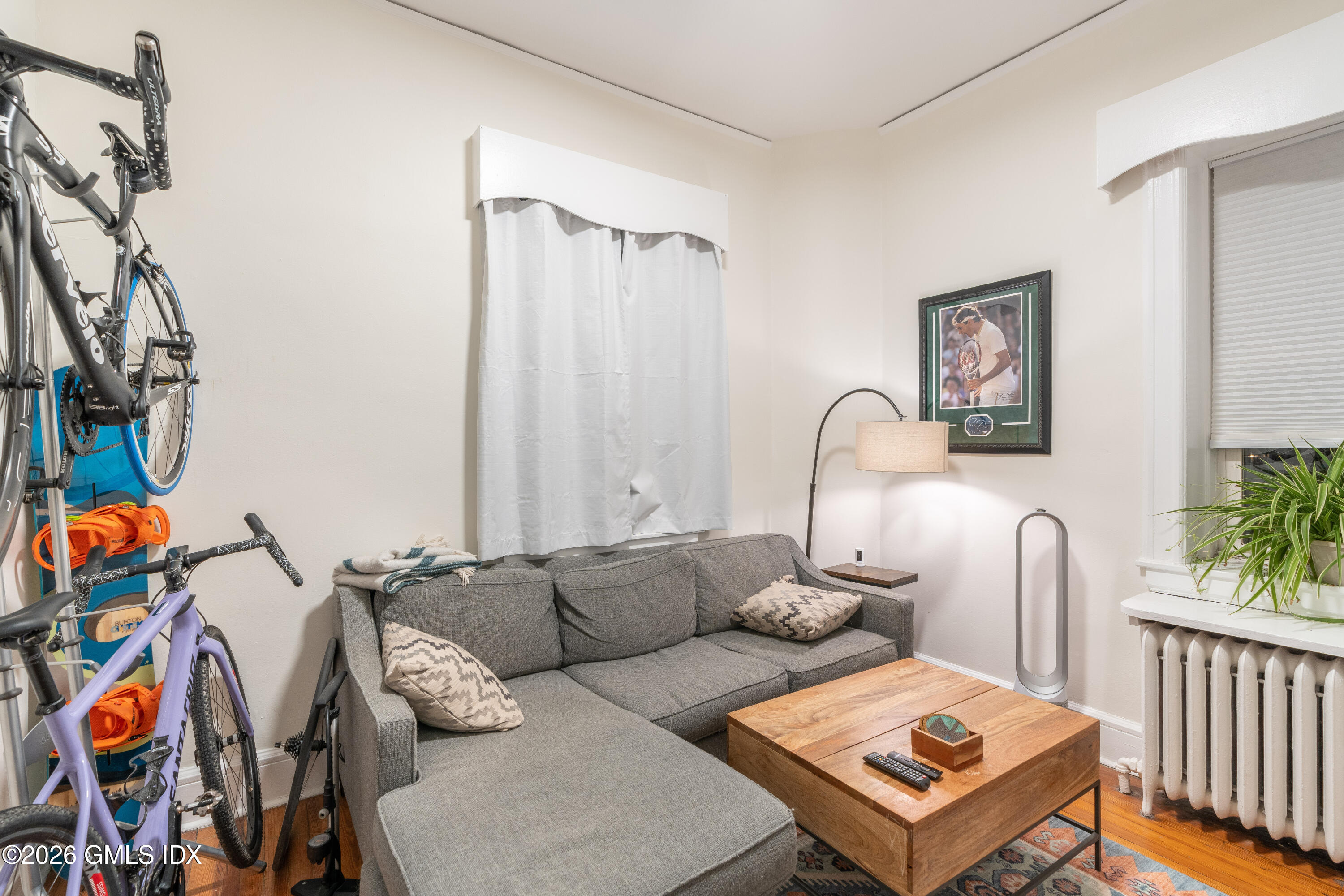 140 Hamilton Avenue, Unit 1 Greenwich, CT 06830 - Photo 6 of 7 a living room with furniture a rug and a window