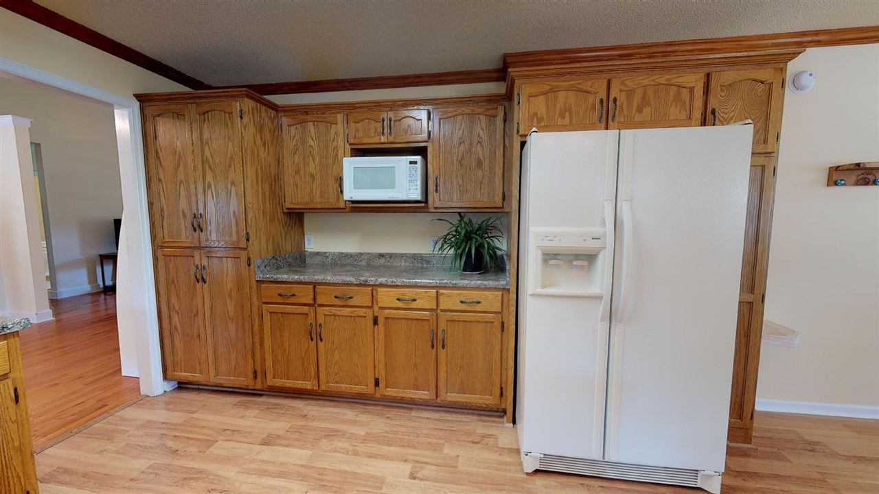 2286 Old Federal Road Ocoee, TN 37361 - Photo 11 of 56 a white refrigerator freezer sitting inside of a kitchen
