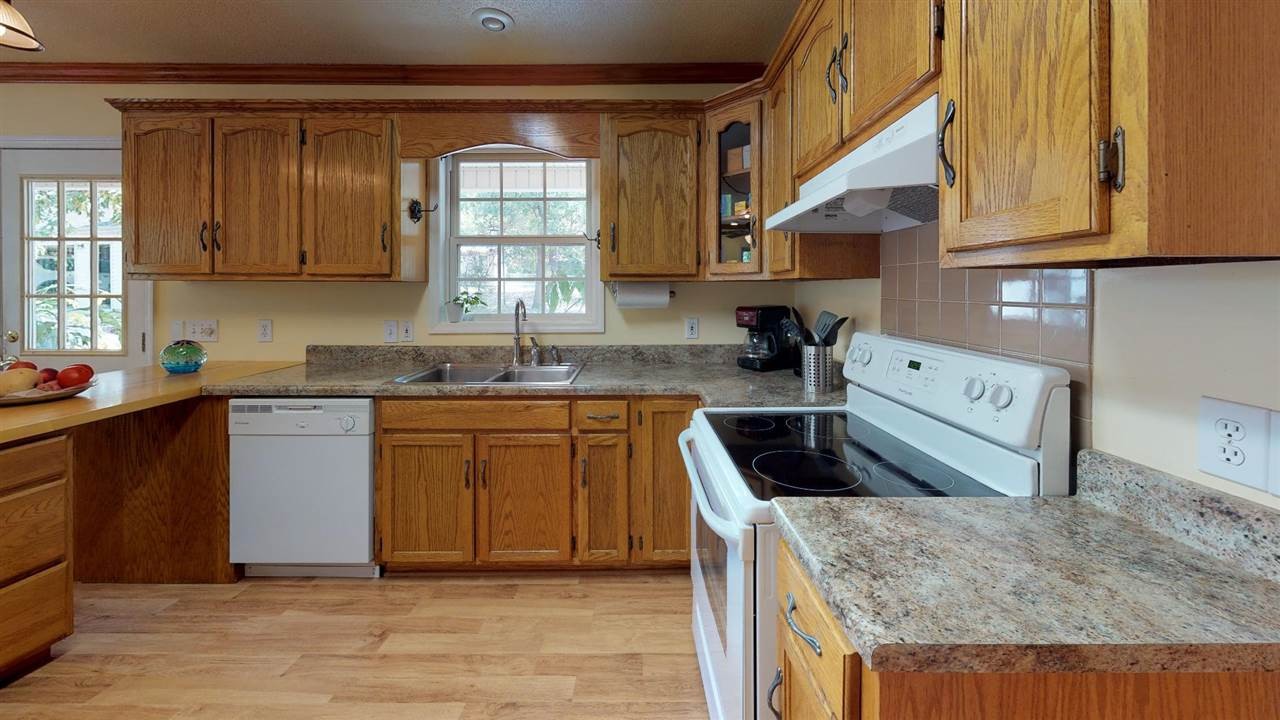 2286 Old Federal Road Ocoee, TN 37361 - Photo 13 of 56 a kitchen with granite countertop a sink a stove and cabinets