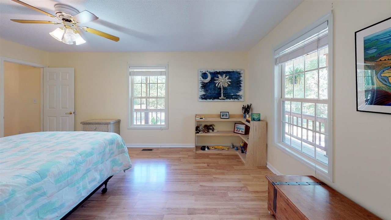 2286 Old Federal Road Ocoee, TN 37361 - Photo 17 of 56 a bedroom with a bed and a chandelier