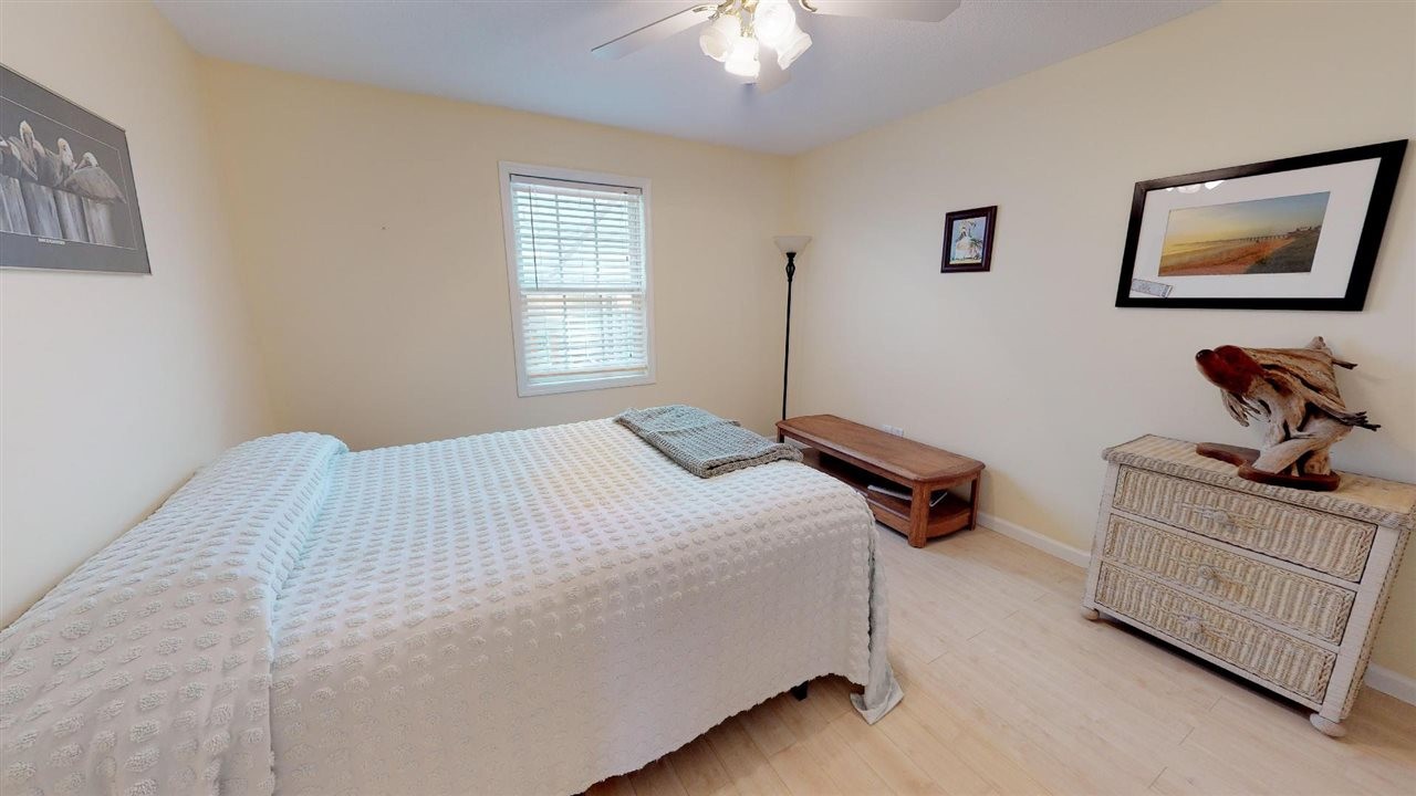 2286 Old Federal Road Ocoee, TN 37361 - Photo 22 of 56 a bedroom with a bed and a chandelier