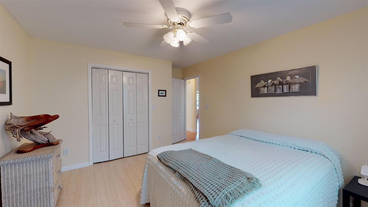 2286 Old Federal Road Ocoee, TN 37361 - Photo 23 of 56 a bedroom with a bed and a chandelier
