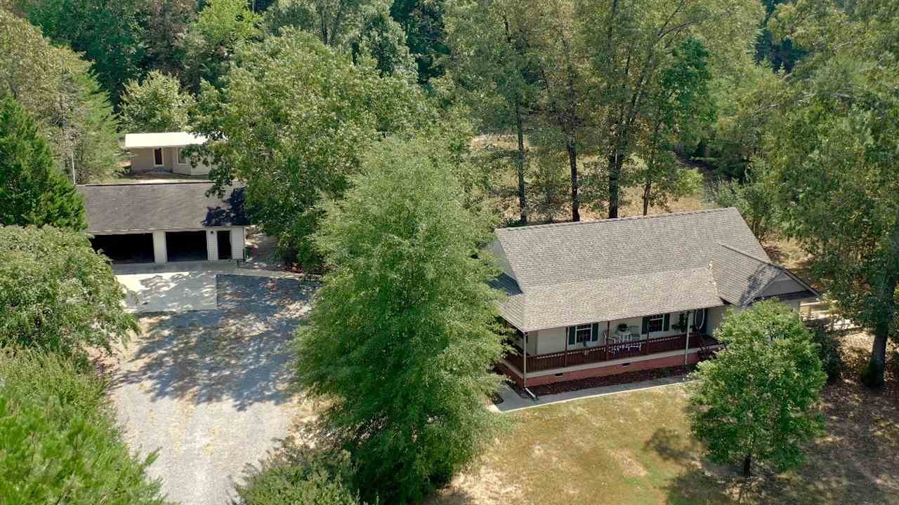 2286 Old Federal Road Ocoee, TN 37361 - Photo 43 of 56 an aerial view of a house with a yard large trees and barn in the back