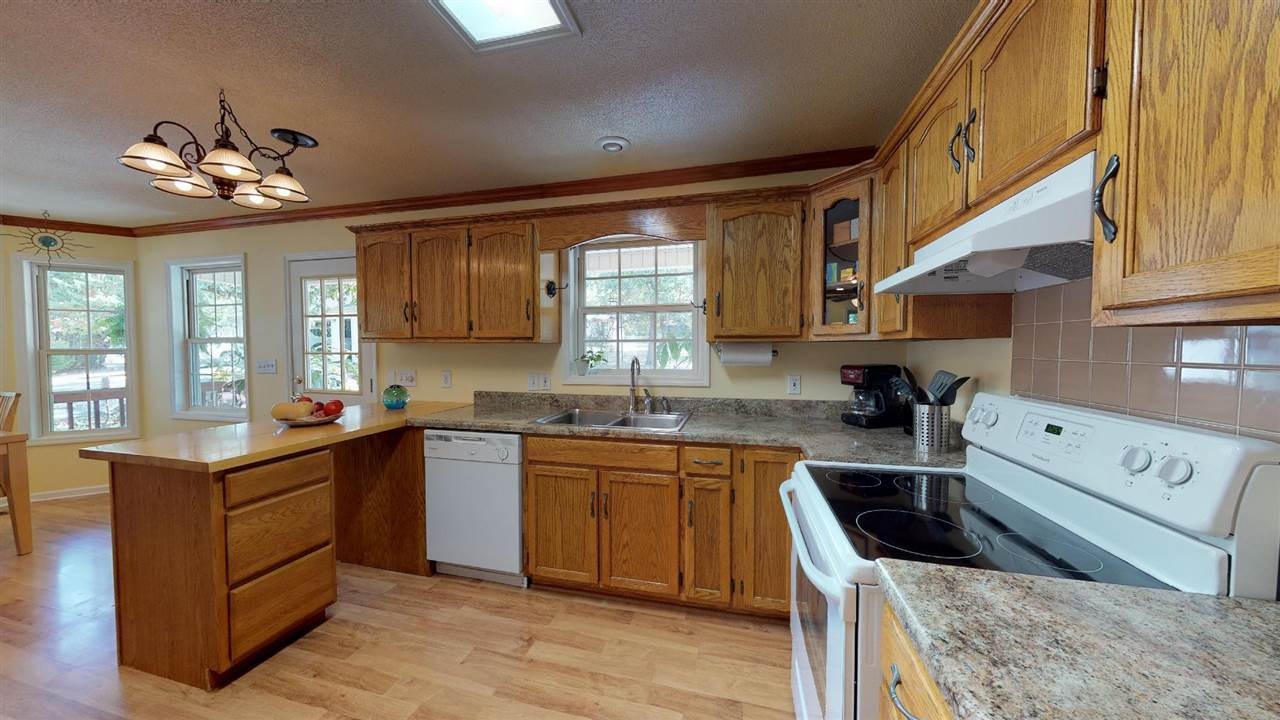 2286 Old Federal Road Ocoee, TN 37361 - Photo 10 of 56 a kitchen with a stove a sink a microwave and cabinets