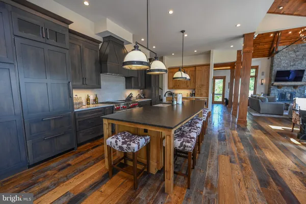 a view of an entryway with wooden floor and a livingroom