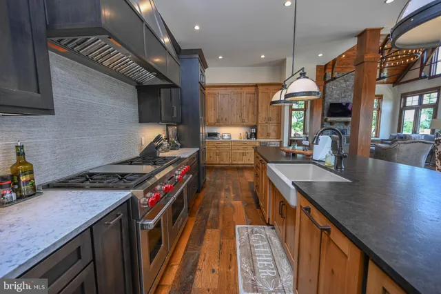 a view of an entryway with wooden floor and a livingroom