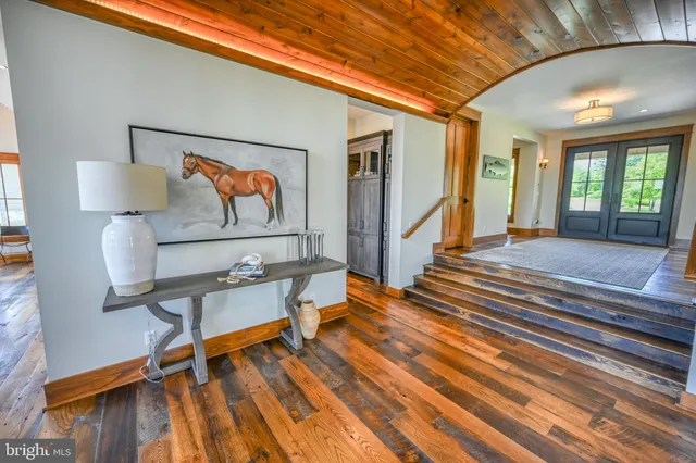 a bathroom with a double vanity sink and mirror with shower