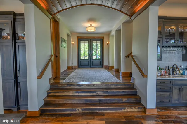 a bedroom with a bed and a table