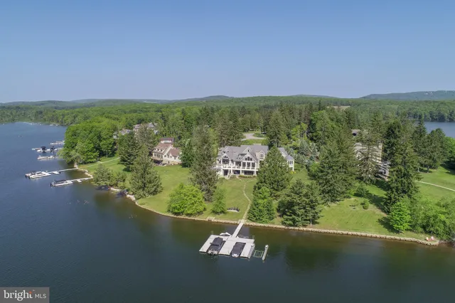 a living room with fireplace furniture and a flat screen tv