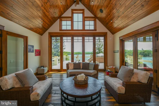 a view of a dinning table and chairs in patio of the house