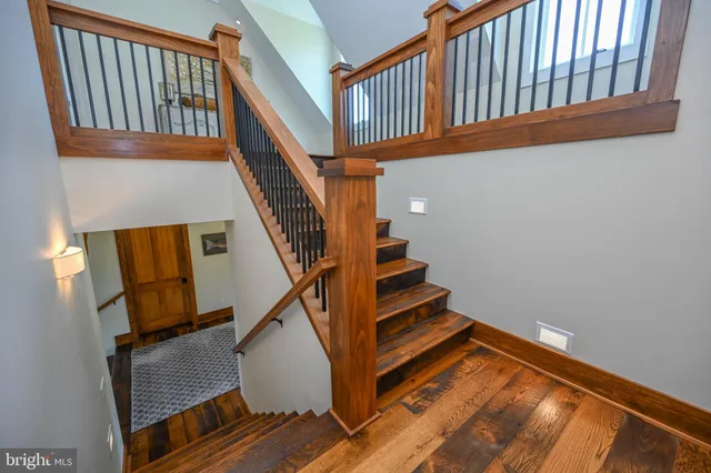 a view of a patio with couches table and chairs and potted plants