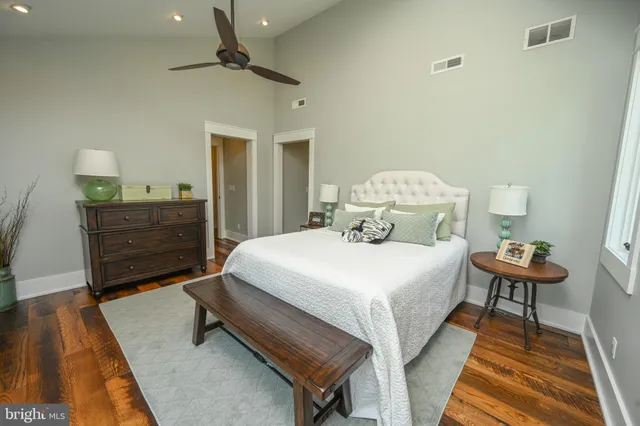 a aerial view of a house with a yard table and chairs