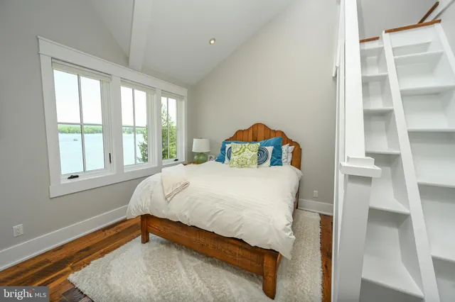 an aerial view of a house with a lake view