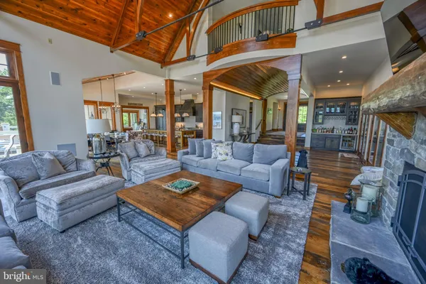 a kitchen with stainless steel appliances granite countertop a refrigerator a sink and a stove