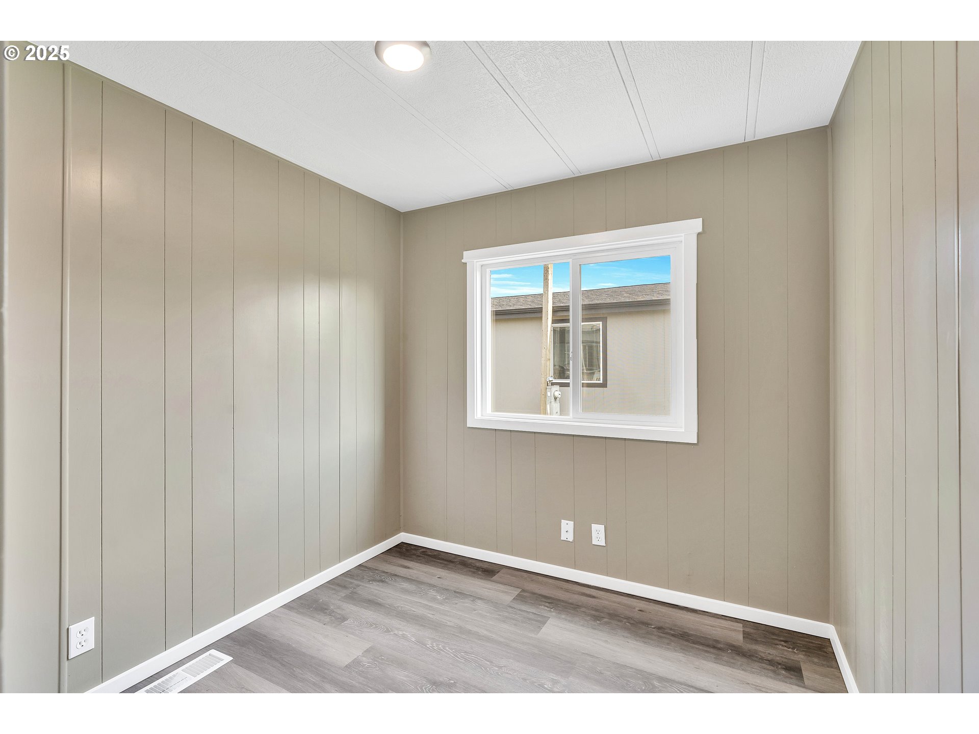 10701 Southeast Highway 212, Unit J3 Clackamas, OR 97015 - Photo 16 of 42 a view of an empty room with a window