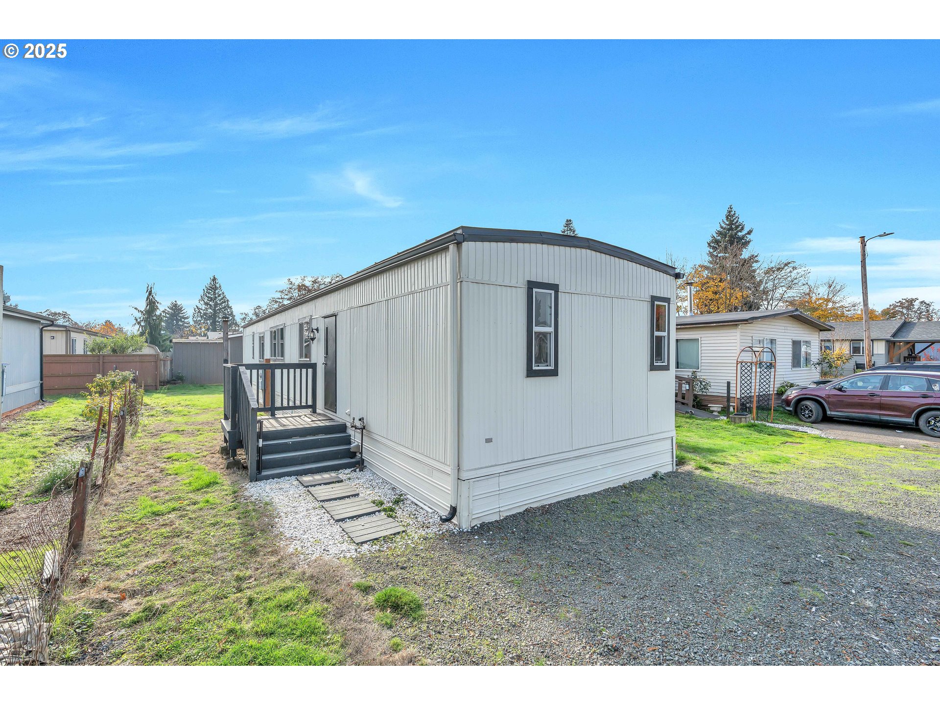 10701 Southeast Highway 212, Unit J3 Clackamas, OR 97015 - Photo 24 of 42 a view of a house with backyard and sitting area