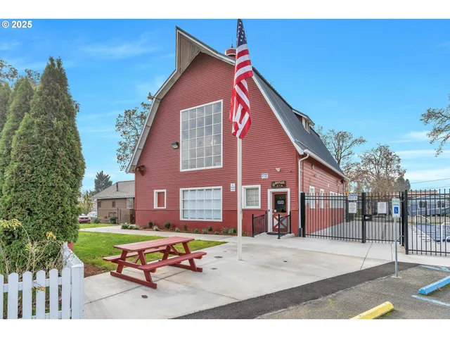 a backyard of a house with outdoor seating