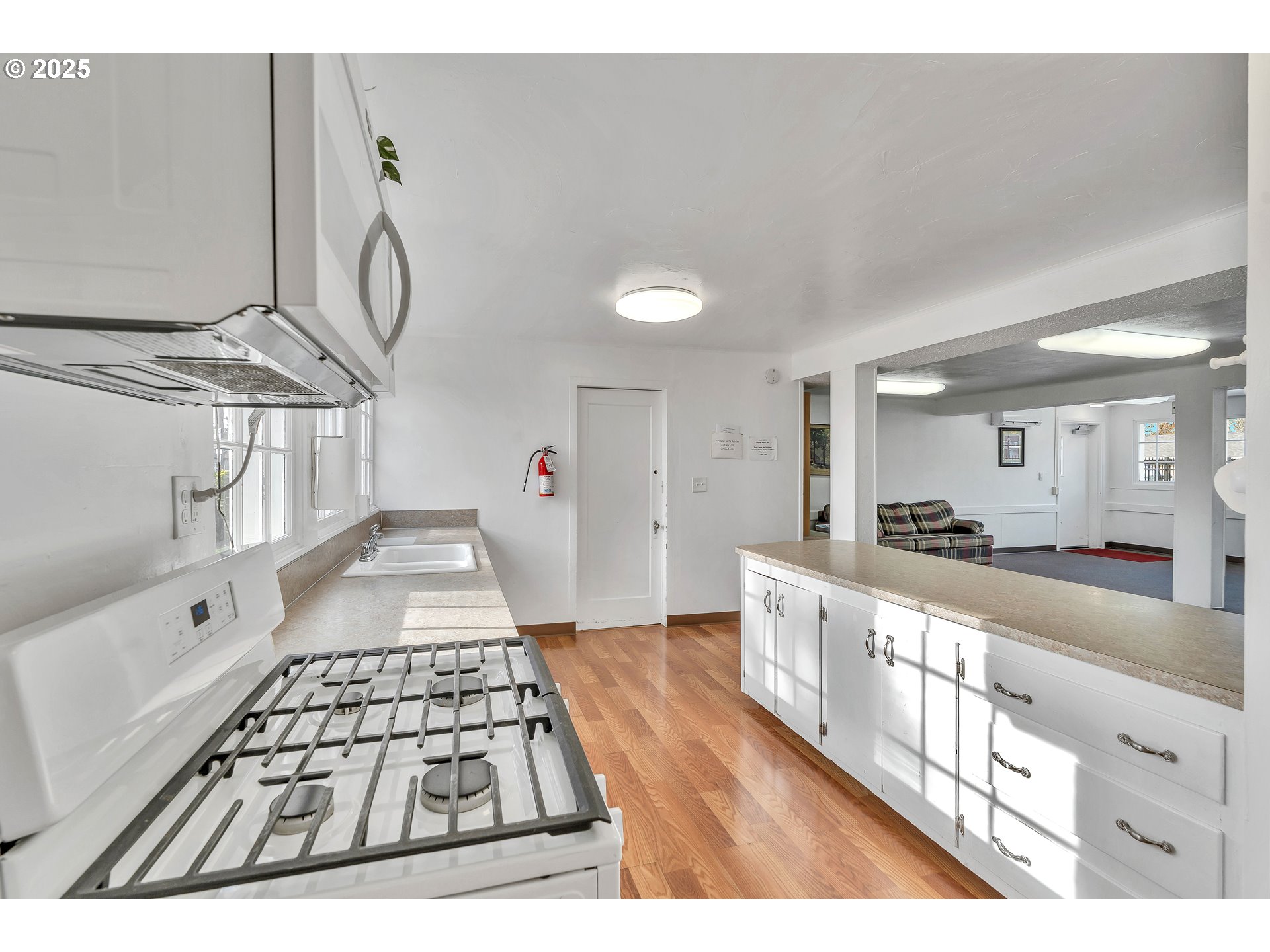 10701 Southeast Highway 212, Unit J3 Clackamas, OR 97015 - Photo 34 of 42 a view of a hallway with wooden floor
