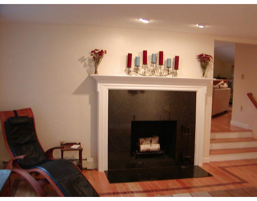 11 Quail Run Road Bellingham, MA 02019 - Photo 11 of 22 a living room with furniture and a fireplace