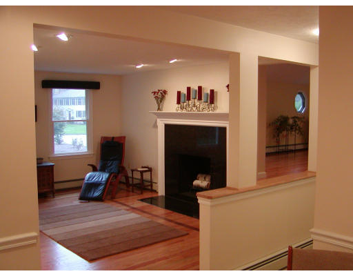 11 Quail Run Road Bellingham, MA 02019 - Photo 12 of 22 a room with furniture and a fireplace